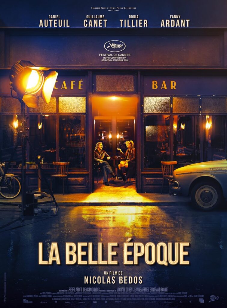 Poster of "La Belle Époque" shows two people sitting outside a café under warm lighting. The names Daniel Auteuil, Guillaume Canet, Doria Tillier, and Fanny Ardant appear above the Cannes Festival logo. Nearby, a dubbing studio sign subtly hints at the film's international appeal.